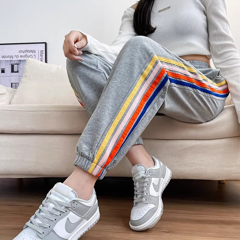 High-waisted Ankle-tied Joggers With A Gray-and-white Rainbow Stripe Design